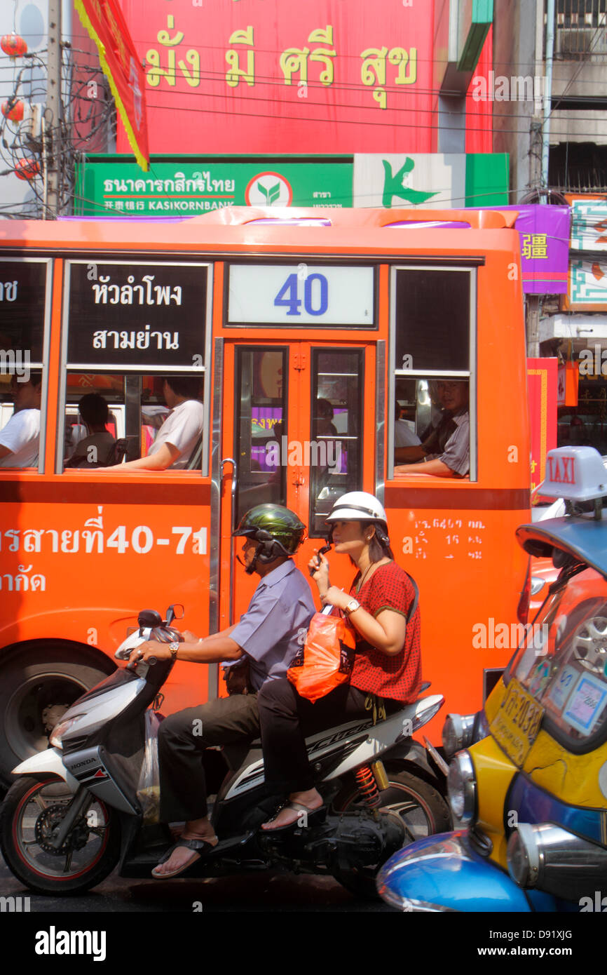Bangkok Thailand,Thai,Samphanthawong,Chinatown,Yaowarat Road,motorcycle motorcycles,bus,coach,traffic,visitors travel traveling tour tourist tourism l Stock Photo
