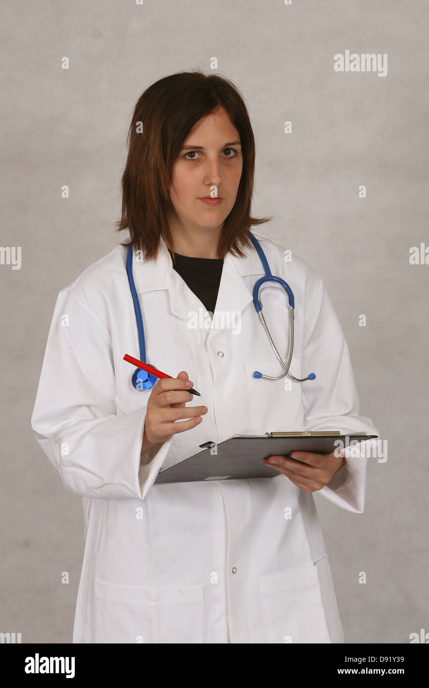 May 2007 - Medical professionals, doctor and or nurse. shot on grey background for isolating, Stock Photo