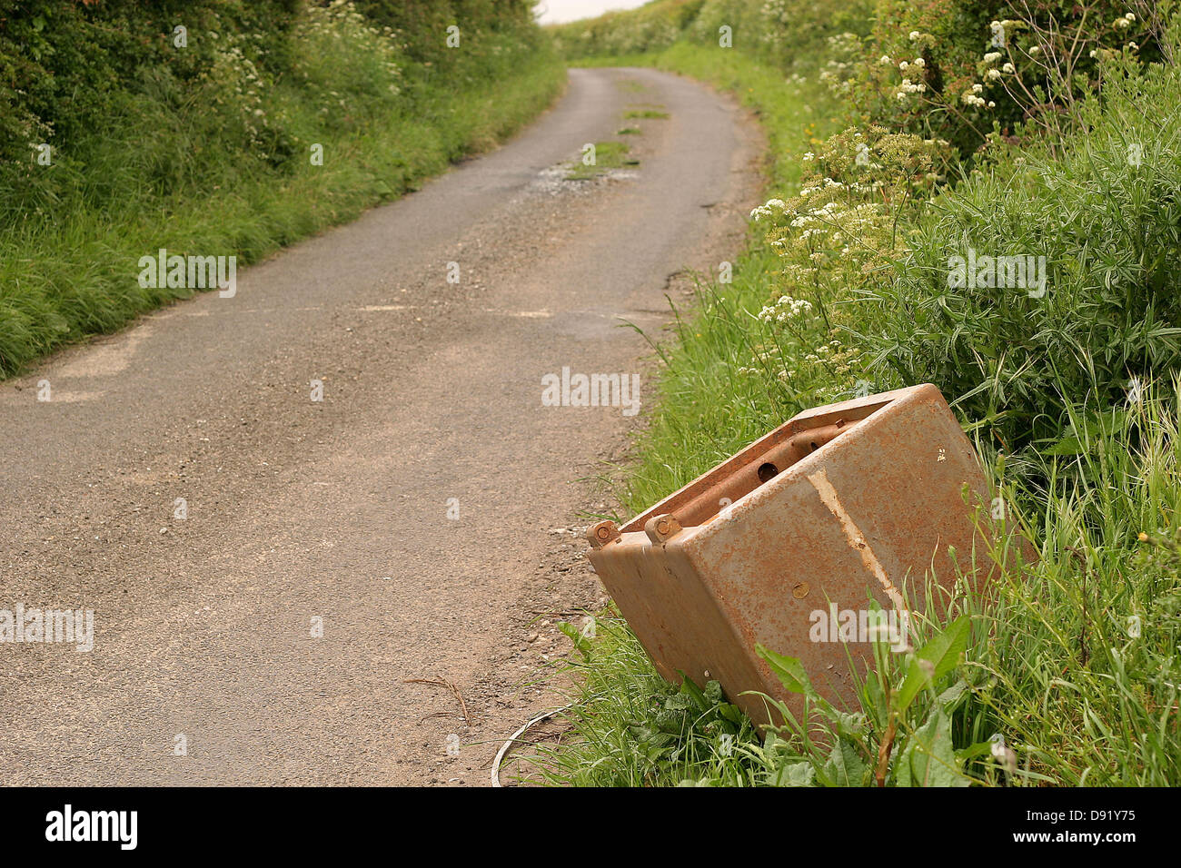 Old safe which had previously been stolen dumped beside a quiet rural lane, May 2007 Stock Photo