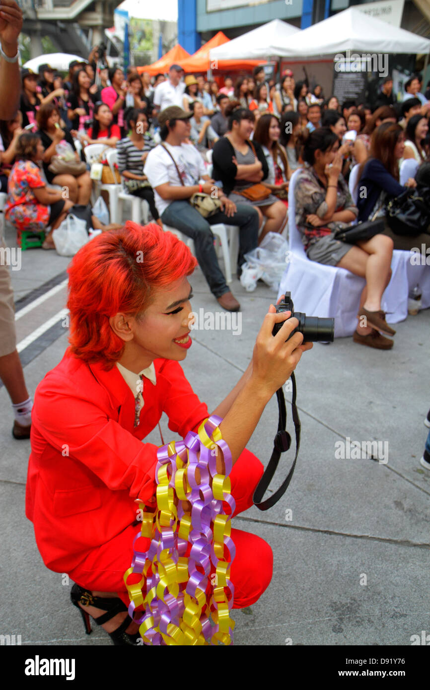 Thailand,Thai,Bangkok,Pathum Wan,Rama 1 Road,MBK Center,centre,talent show,Asian man men male,cross dresser,red dyed hair,well dressed,journalist,repo Stock Photo