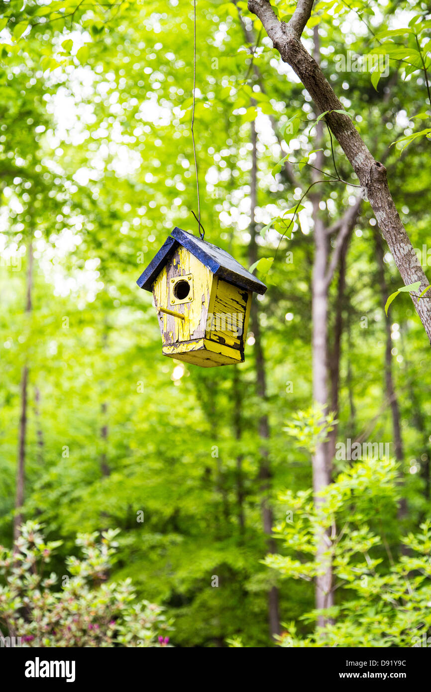 Hand crafted birdhouse in a manicured garden. North Carolina Stock Photo