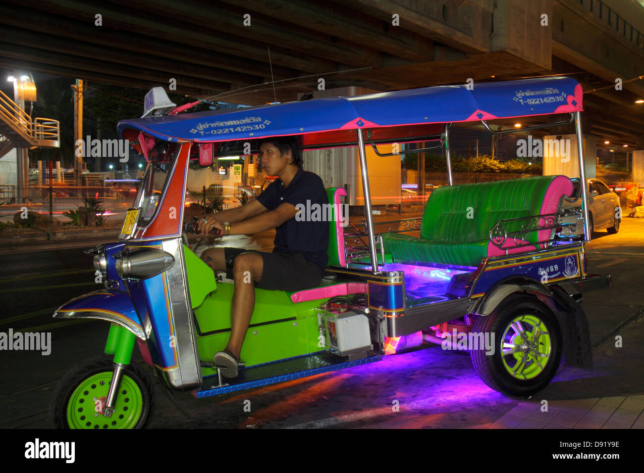 Bangkok Thailand,Thai,Pathum Wan,Rama 1 Road,taxi,auto rickshaw,tuk-tuk,sam-lor,night evening,Asian man men male,driver,job,working,work,Thai130209148 Stock Photo