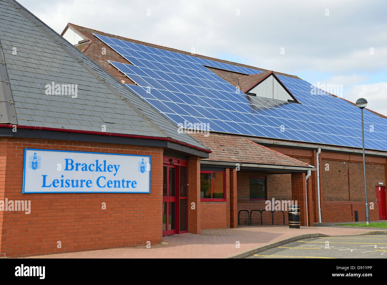 Solar panels on roof of Brackley Leisure Centre, Springfield Way, Brackley, Northamptonshire, England, United Kingdom Stock Photo