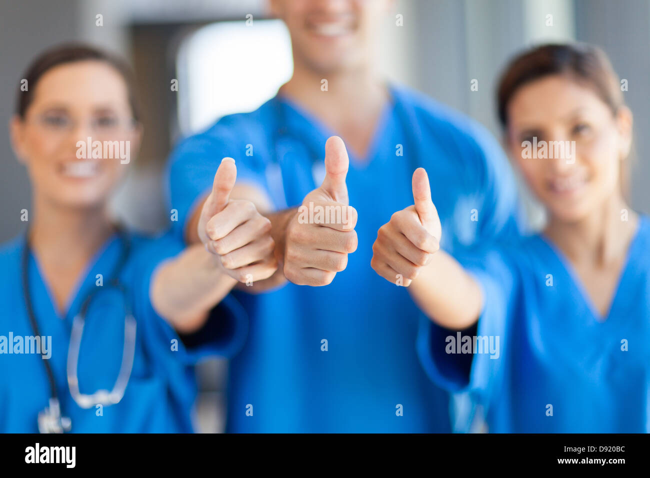 group of healthcare workers thumbs up Stock Photo
