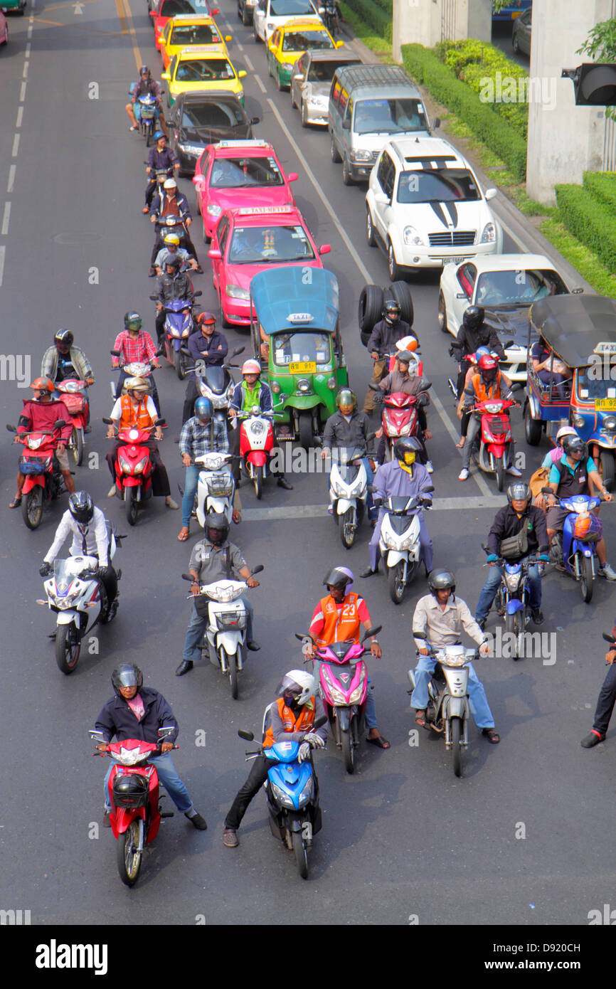 Thailand,Thai,Bangkok,Pathum Wan,Phaya Thai Road,traffic,taxi taxis,cab,cabs,motorcycles,motor scooters,buses,auto rickshaw,tuk-tuk,sam-lor,Skywalk,vi Stock Photo