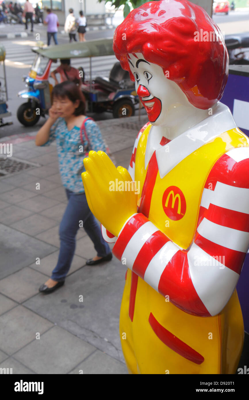 Bangkok Thailand,Thai,Silom,Silom Road,McDonald's,burgers,hamburgers,fast food,restaurant restaurants dining cafe cafes,Ronald,mascot,statue,Thai trad Stock Photo