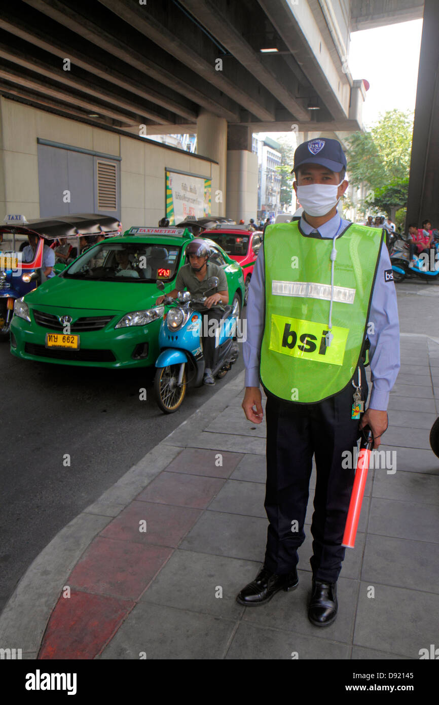 Bangkok Thailand,Thai,Pathum Wan,Rama 1 Road,security guard,traffic control officer,face mask,Thai130213001 Stock Photo