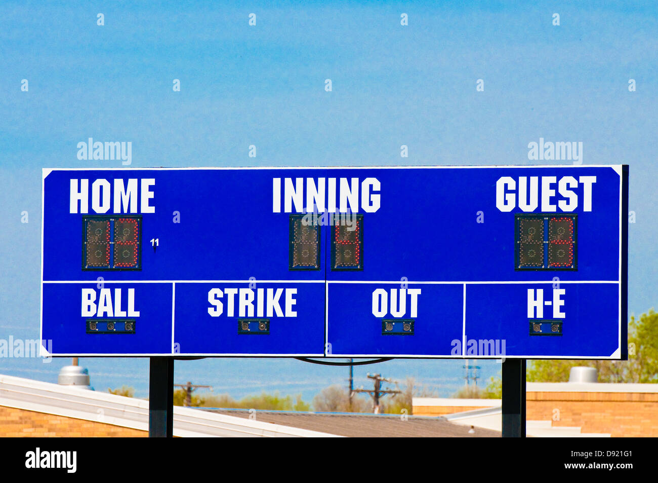 Baseball scoreboard with blue skky in the background. Stock Photo