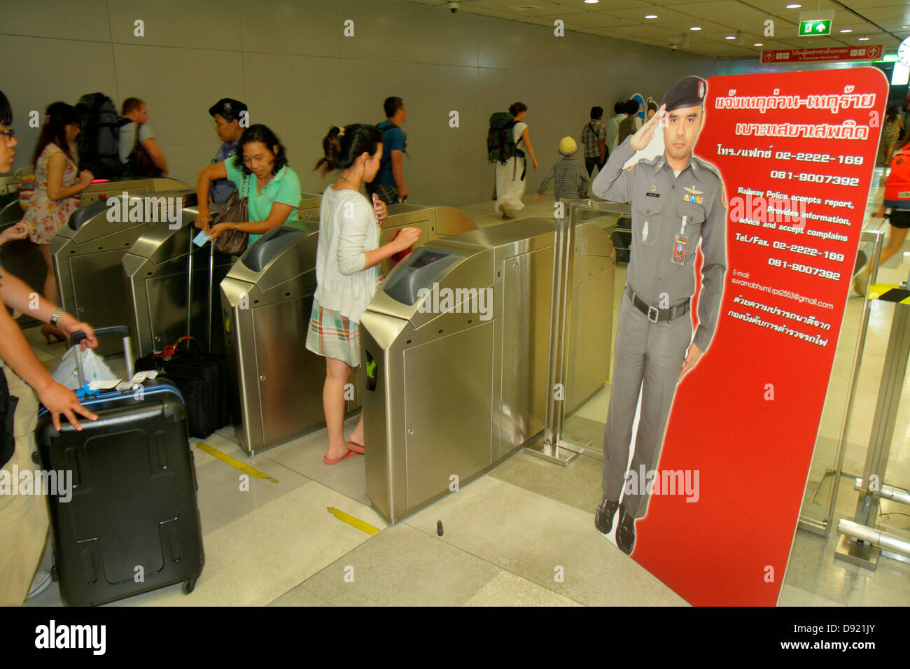Thailand,Thai,Bangkok,Suvarnabhumi International Airport,BKK,SRT Airport Link PhayaThai,Bangkok Mass Transit System,passenger passengers rider riders, Stock Photo