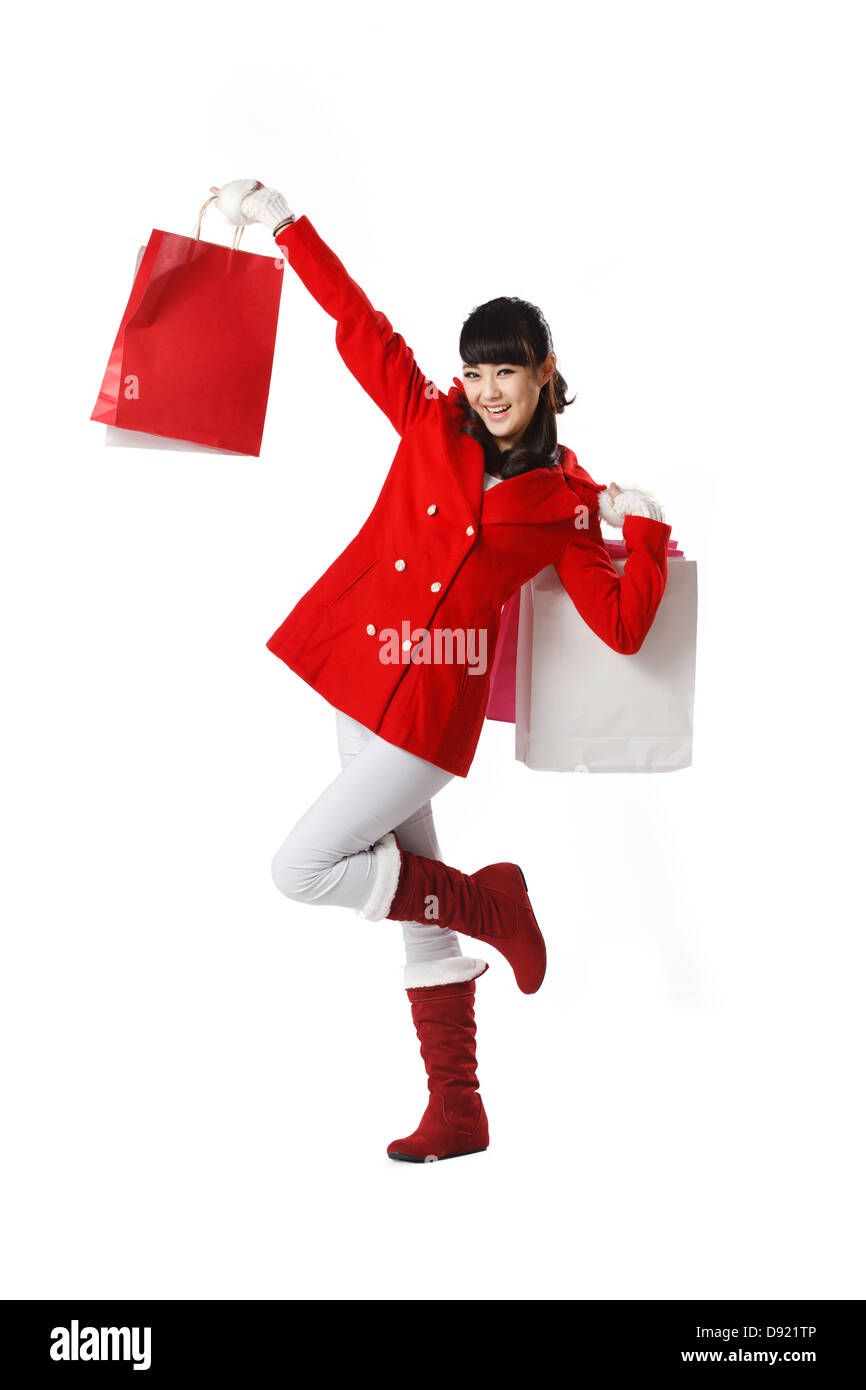Young woman holding Christmas gift Stock Photo - Alamy
