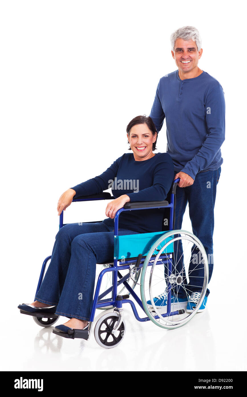 smiling middle aged man pushing handicapped wife on wheelchair isolated on  white background Stock Photo - Alamy