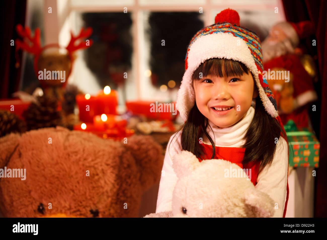 a happy girl and toy in her handgirl with christmas gift stock photo christmas girl toy