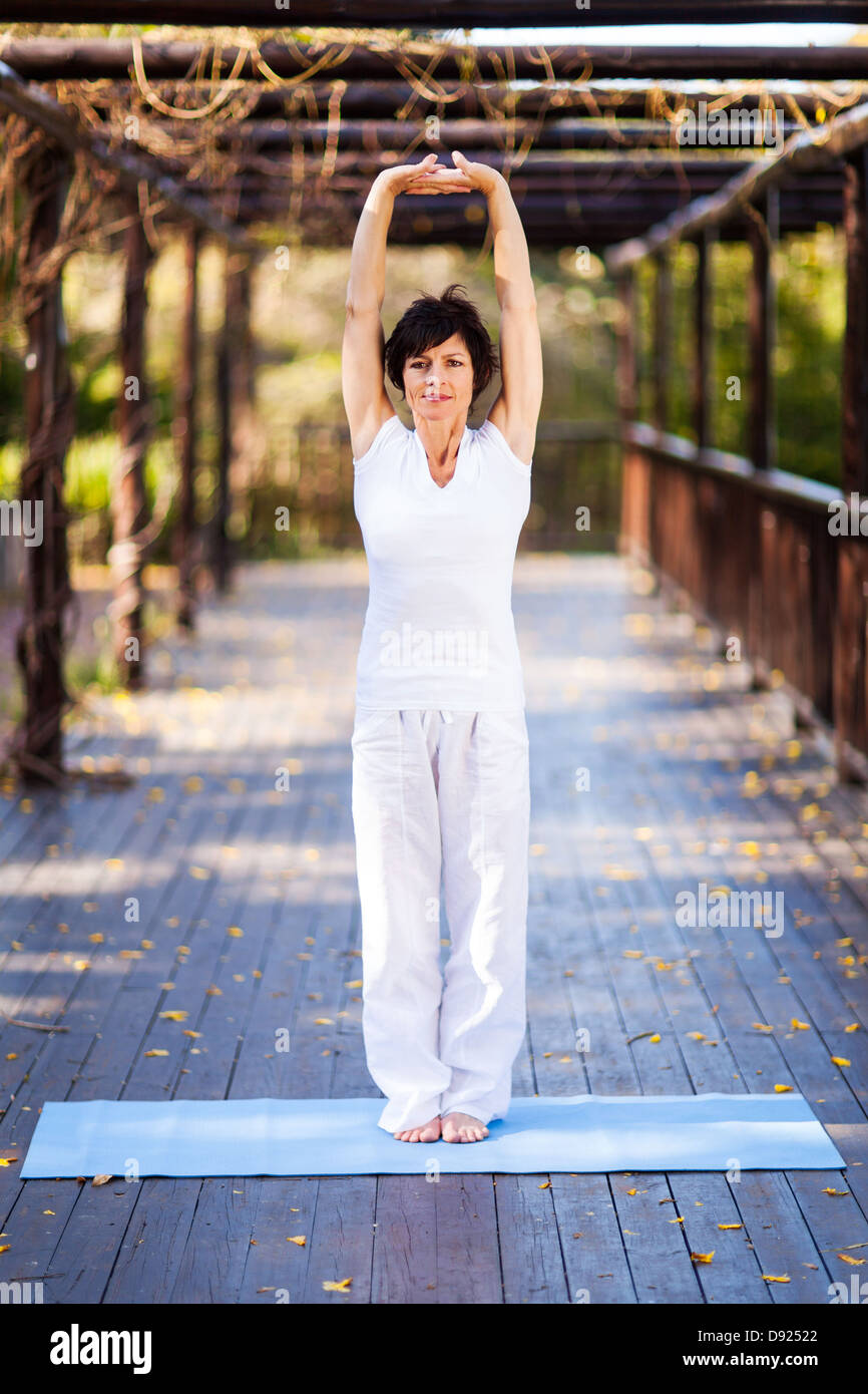 Middle aged woman stretching arms hi-res stock photography and images ...