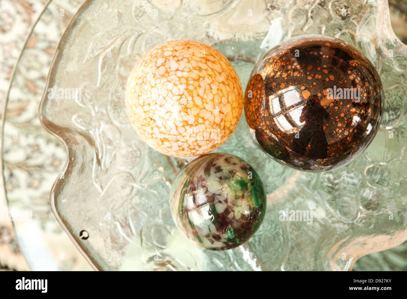 Some Decorative Christmas Spheres In A Glass Bowl Stock Photo