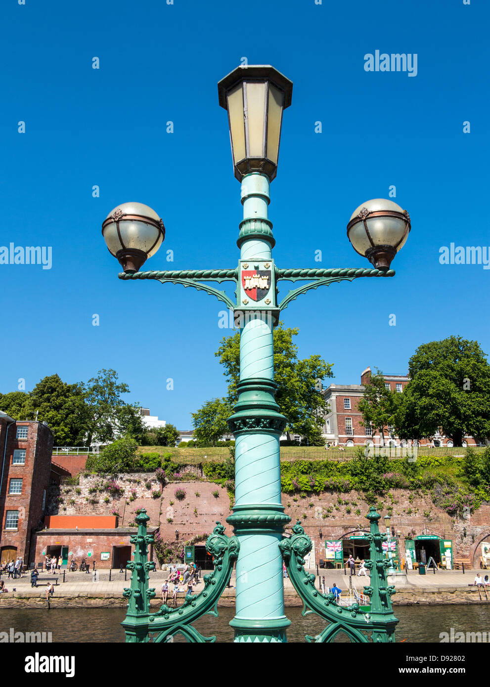 Cast iron antique decorative street lamp beside the River Exe at Exeter Quay, Exeter, Devon, England Stock Photo
