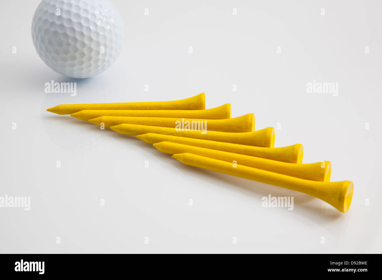 The yellow wooden golf tees Stock Photo Alamy