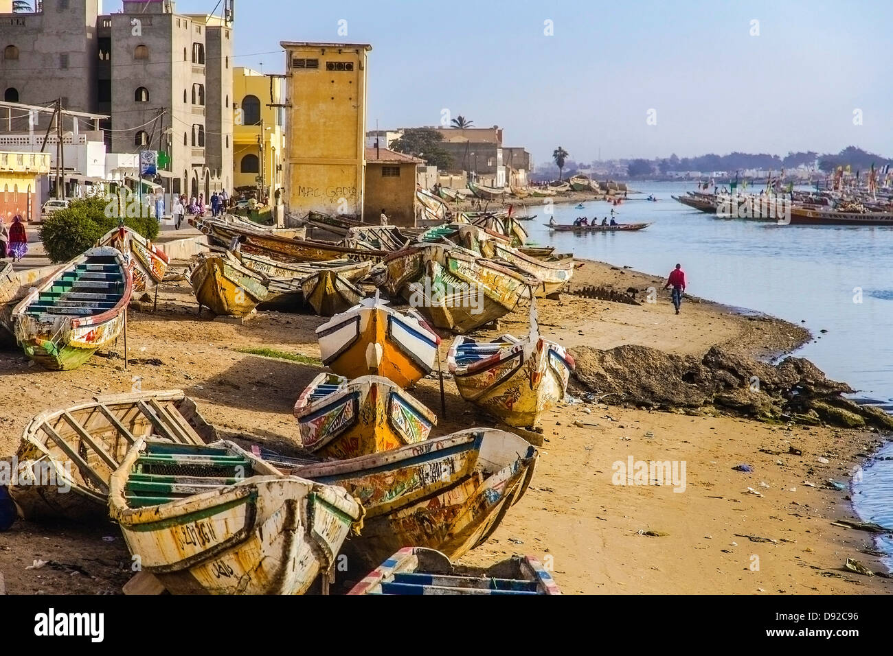 Colourful fishing boats rest on the beach in Saint-Louis, Senegal. Stock Photo