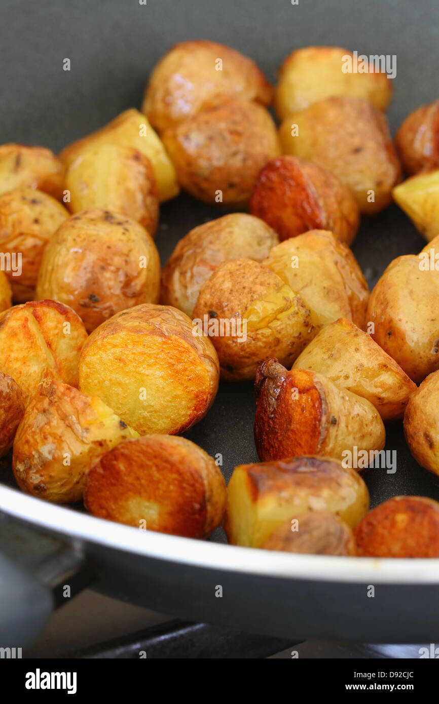 Baby potatoes on frying pan Stock Photo - Alamy