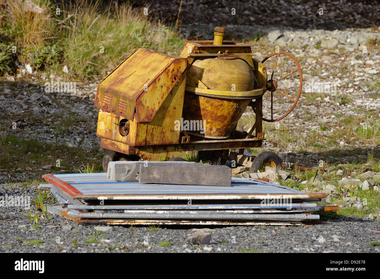 Old cement mixer left on building site Stock Photo Alamy