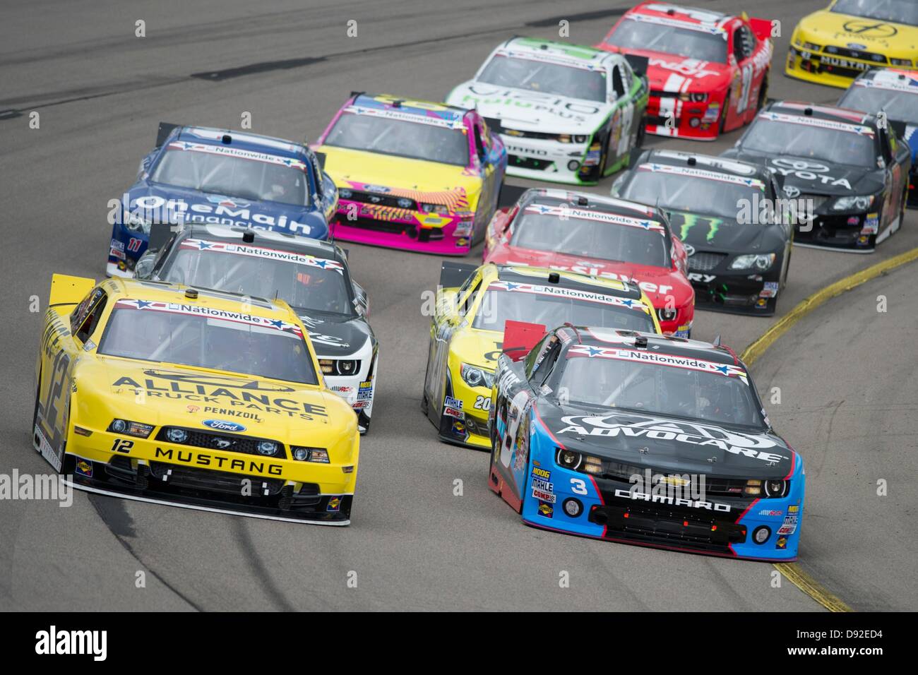 Newton, IA, USA. 9th June, 2013. Austin Dillon (3) and Sam Hornish Jr. (12) head into turn one during the Pioneer Hi-Bred 250 at the Iowa Speedway in Newton, IA. Credit:  Cal Sport Media/Alamy Live News Stock Photo