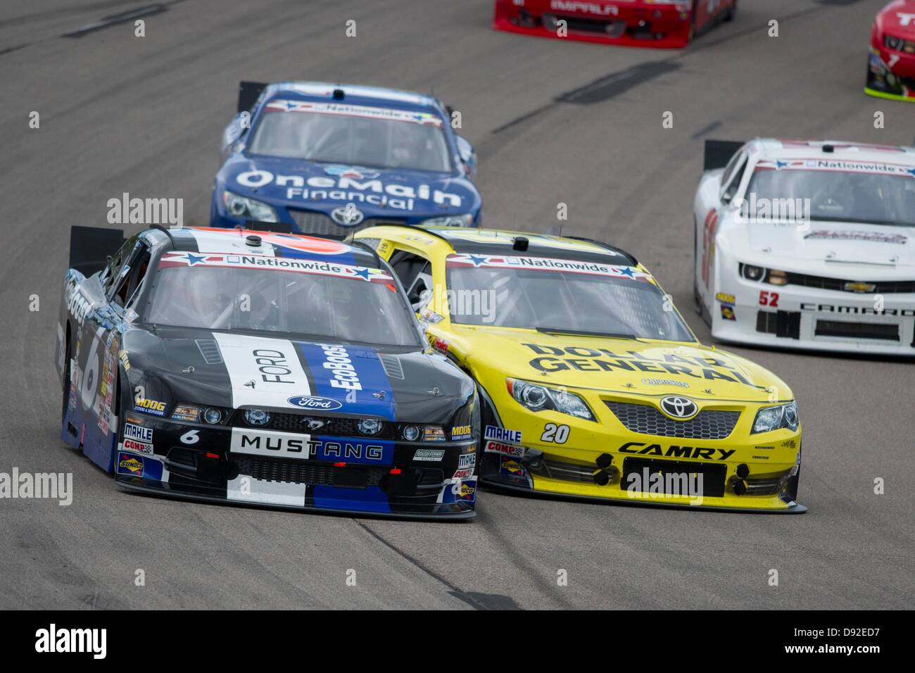 Newton, IA, USA. 9th June, 2013. Brian Vickers (20) gets into Trevor Bayne (6) in turn one during the Pioneer Hi-Bred 250 at the Iowa Speedway in Newton, IA. Credit:  Cal Sport Media/Alamy Live News Stock Photo