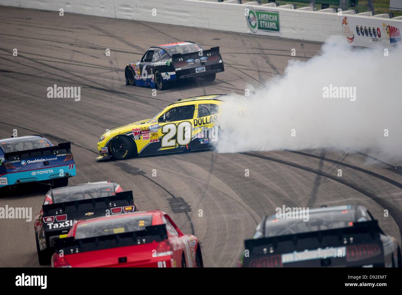 Newton, IA, USA. 9th June, 2013. Brian Vickers (20) skids into turn two during the Pioneer Hi-Bred 250 at the Iowa Speedway in Newton, IA. Credit:  Cal Sport Media/Alamy Live News Stock Photo