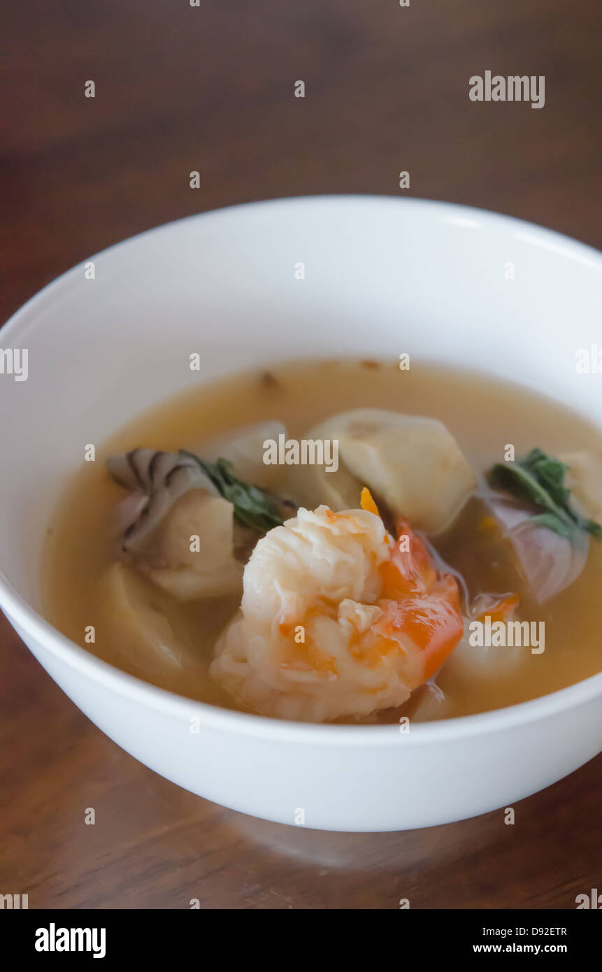 Tom Yum Goong - Thai hot and spicy soup seafood with shrimp in white bowl Stock Photo