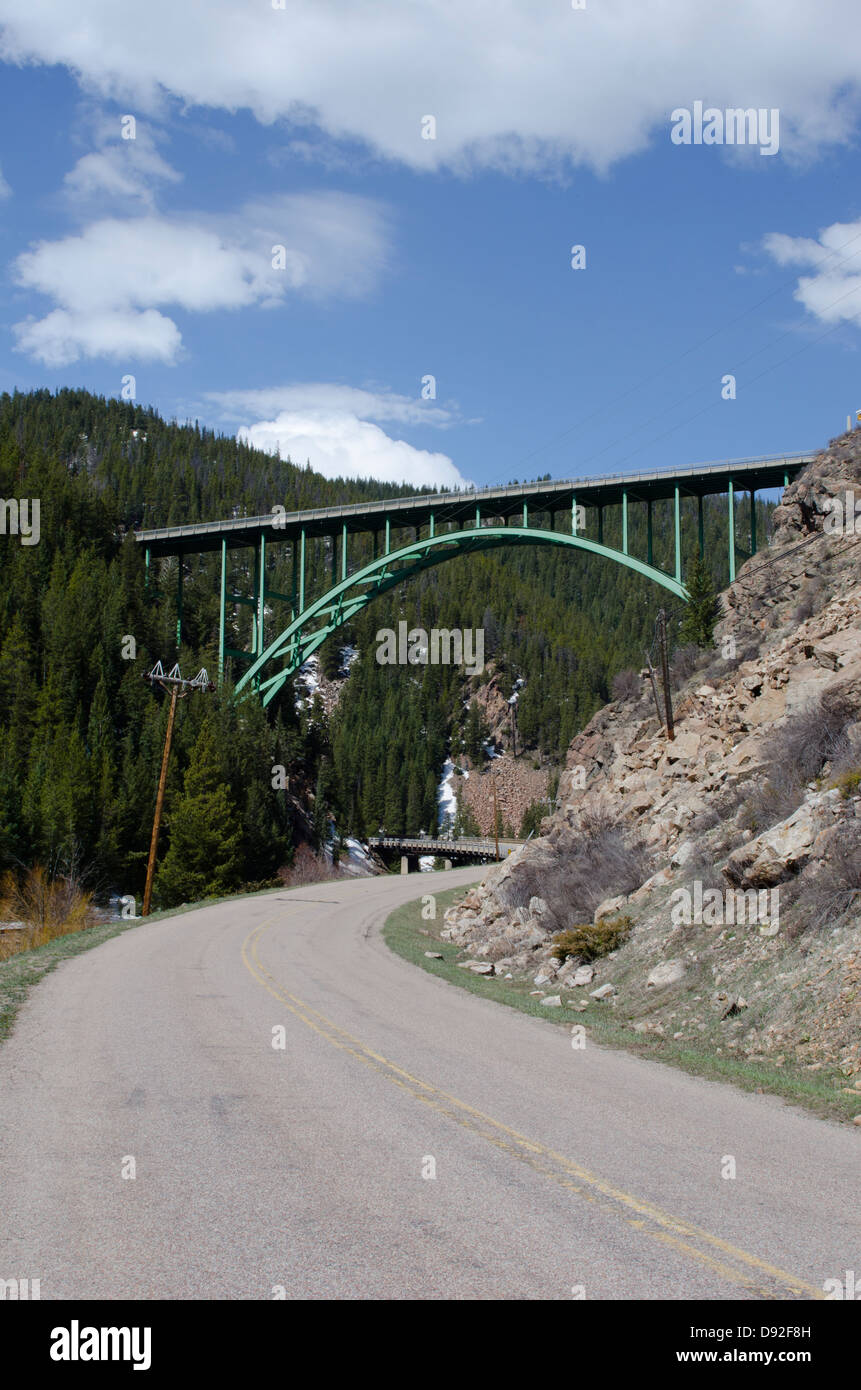 One of only two steel arch bridges in the state of Colorado, the Eagle River bridge near Red Cliff spans the river in 470 feet. Stock Photo