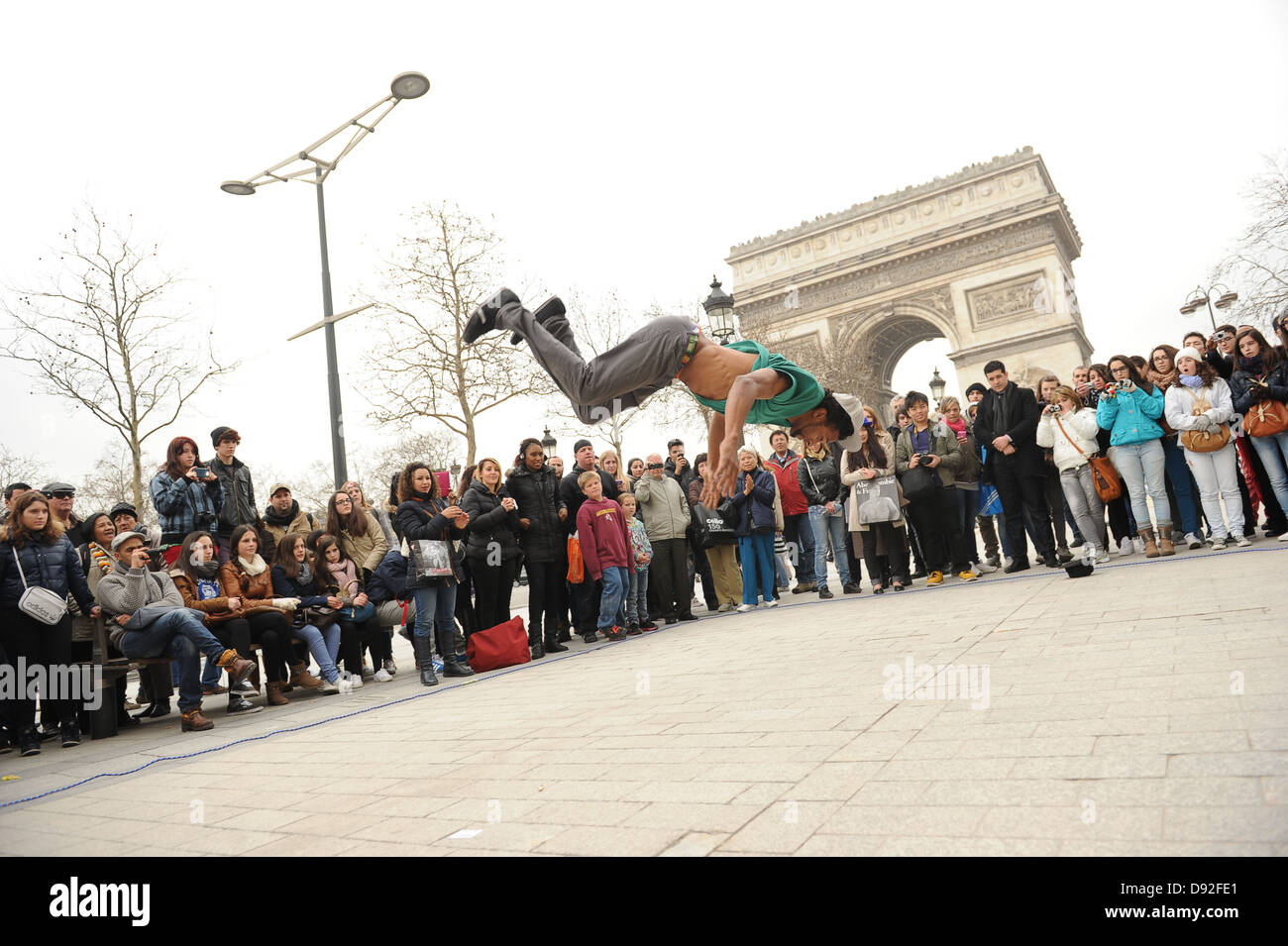 Break dancer entertaining crowd on the street Paris France. Break dancing street entertainment Europe European. Picture by Sam Bagnall Stock Photo