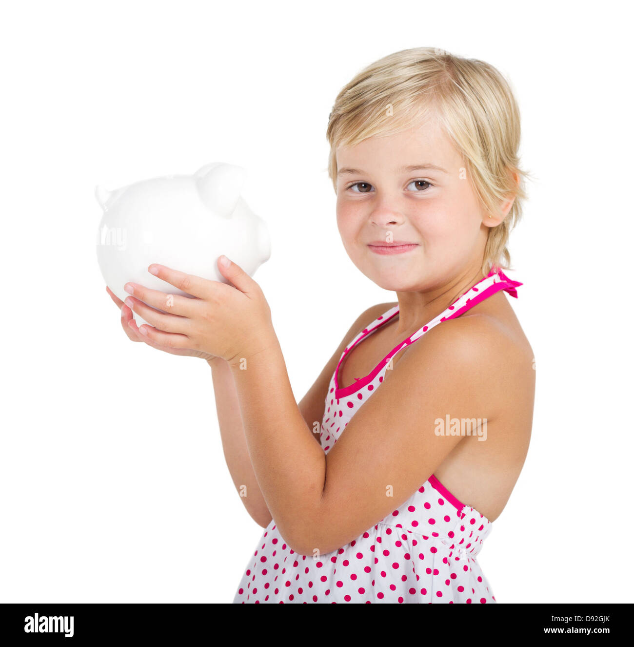 cute little girl holding a piggy bank Stock Photo - Alamy