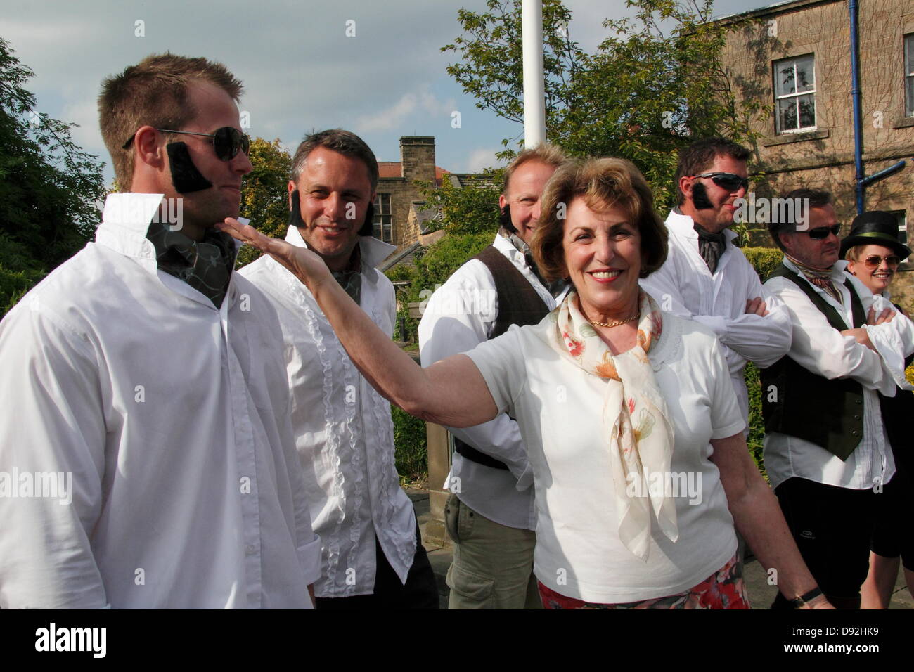 9th June 2013. Bakewell, Derbyshire, UK. Former MP Edwina Currie presides over the Best Dressed Darcy competition prior to the Mr Darcy Custard Pie Fight. The fight marked the 200th anniversary of Jane Austen's Pride and Prejudice that was part written in Bakewell's Rutland Arms Hotel. The fight faced cancellation after organisers had difficulty finding insurance due to health and safety fears. It was reinstated after Olympic insurers stepped in. Teams, with one member dressed as Darcy, had to protect their Darcy while pieing opposing teams. The team with the cleanest Darcy won. Stock Photo