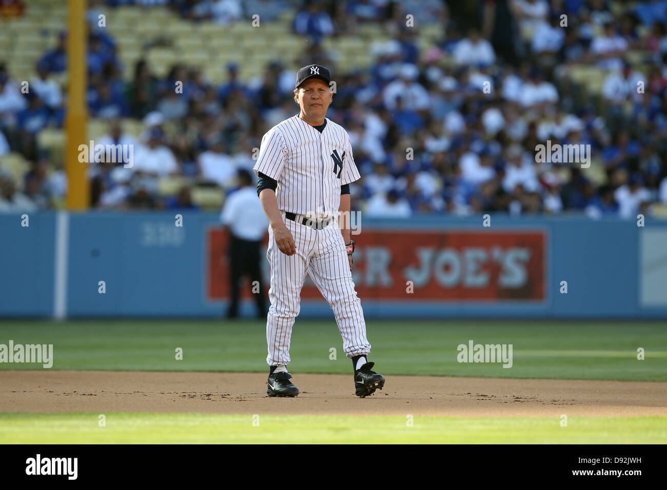 LOS ANGELES, CA - JUNE 08: Actor Billy Crystal plays for the New York Yankees against the Los Angeles Dodgers in an Old Timers Stock Photo