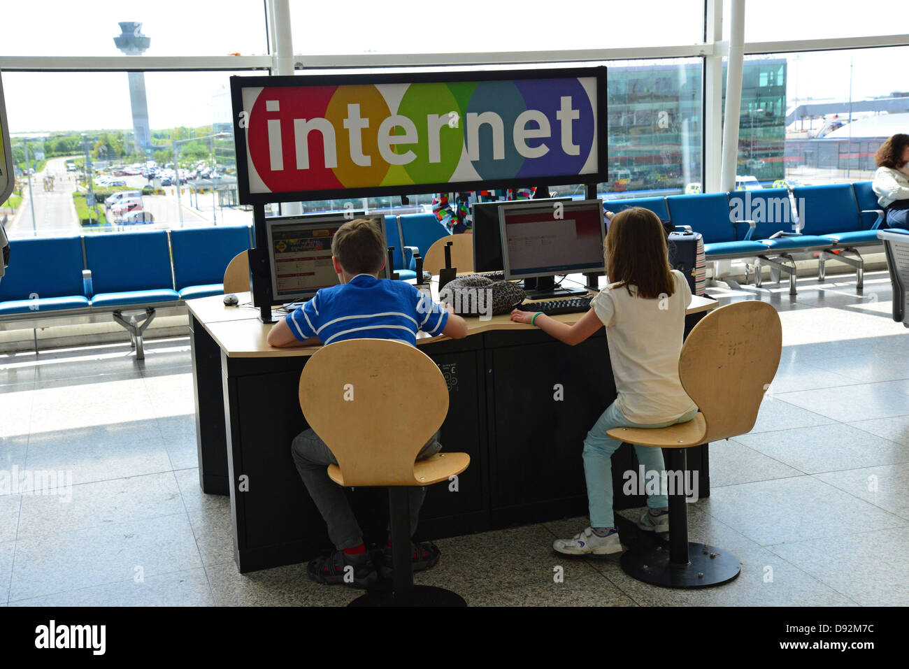 Children at kiosk in departure terminal, Stansted Airport
