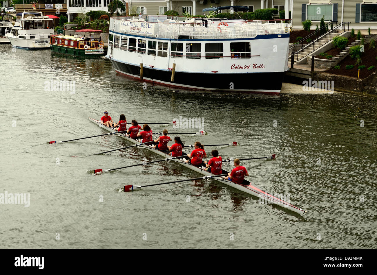 High school scullers practice on Erie Canal harbor at Fairport, NY. Stock Photo