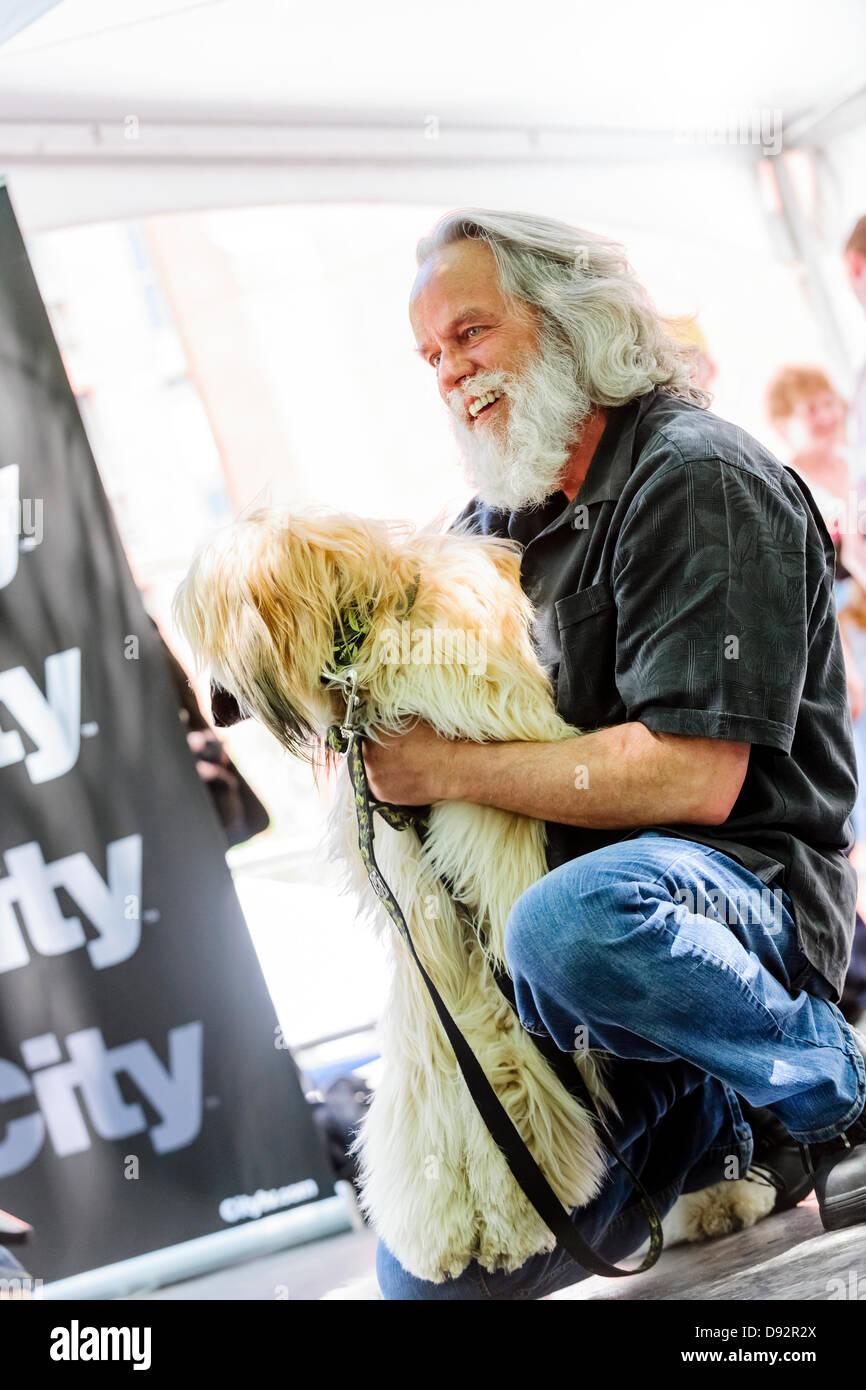 Toronto, Canada, June 9, 2013.  Owner poses with winning female dog in the 10th annual Woofstock dog festival Mister and Ms Canine Canada Pageant to win best couple in show. Credit:  Elena Elisseeva/Alamy Live News Stock Photo