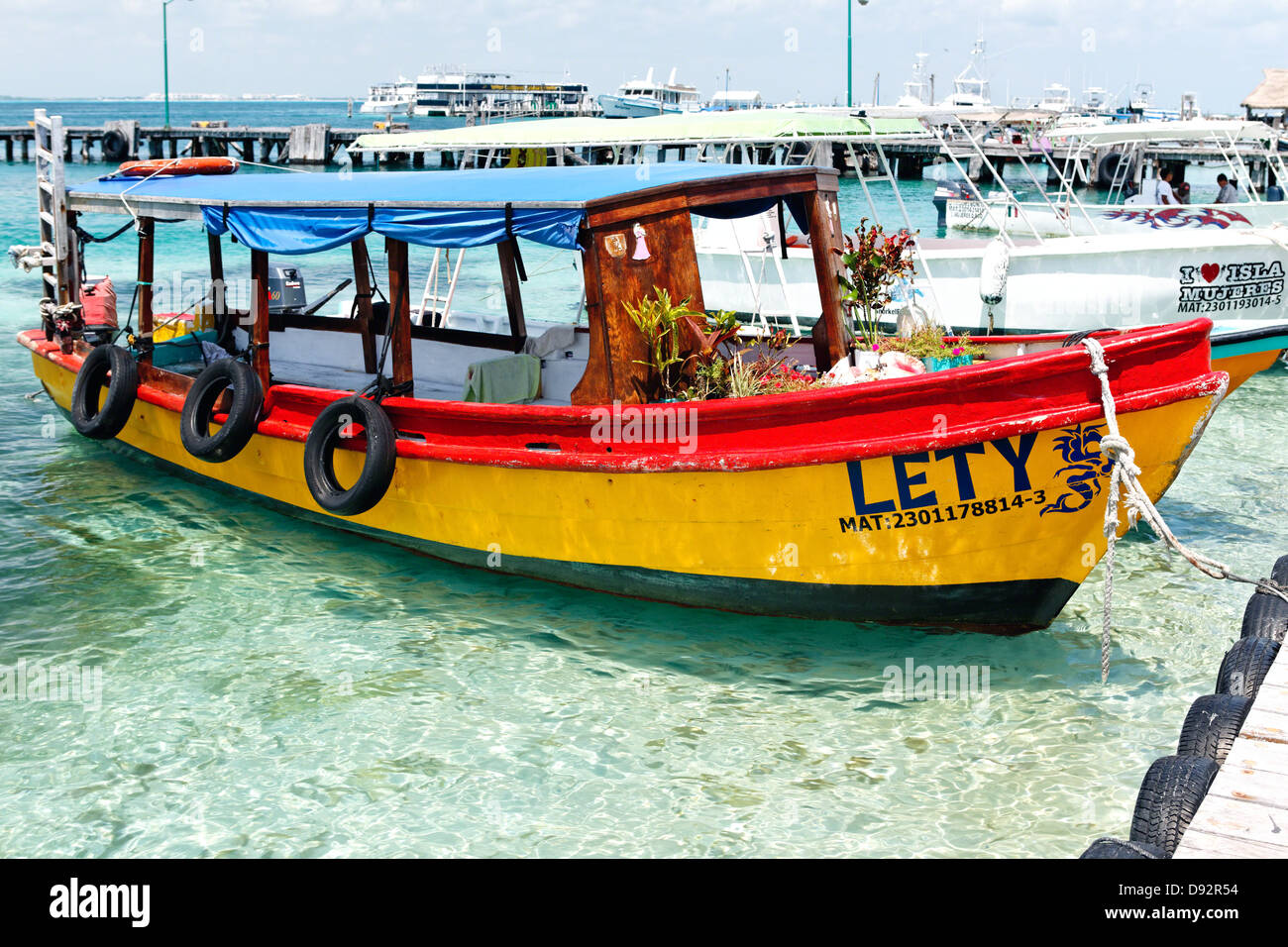 Colorfool Boat at a Pier, Isla Mujeres, Quintana Roo, Mexico Stock Photo