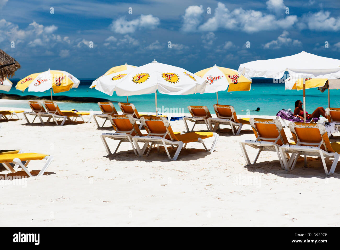 Lounge Chairs and Beach Umbrellas on a Beach, Playa Norte, Isla Mujeres, Mexico Stock Photo
