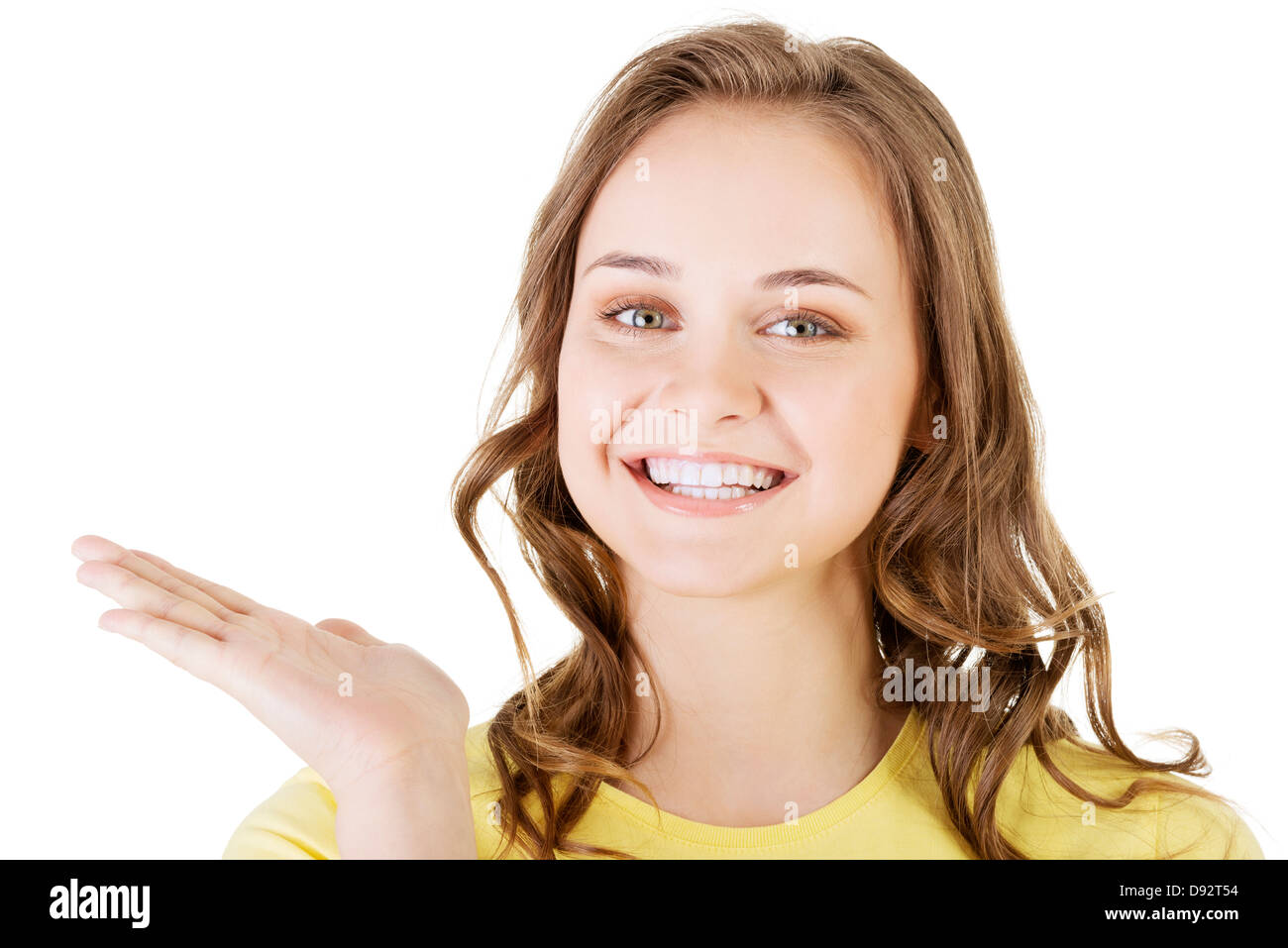 Happy , excited young woman presenting copy space on her palm, isolated ...