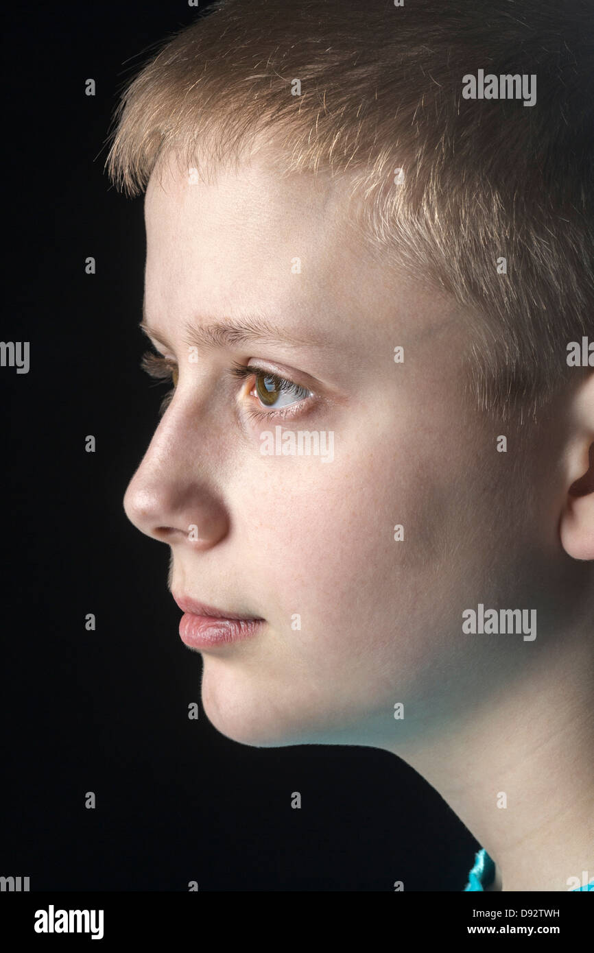 Profile of daydreaming boy Stock Photo