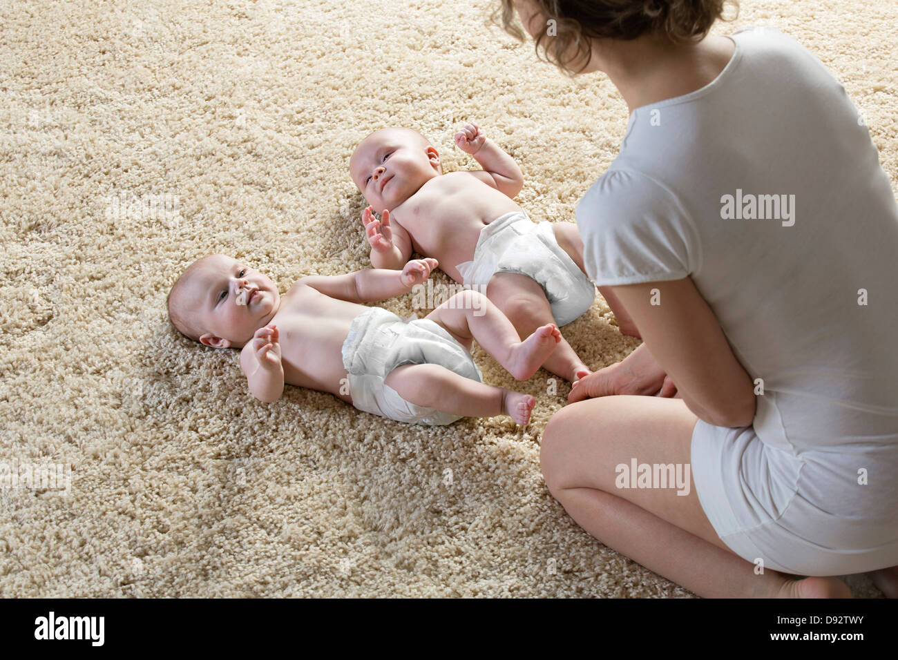 Mother with two babies Stock Photo