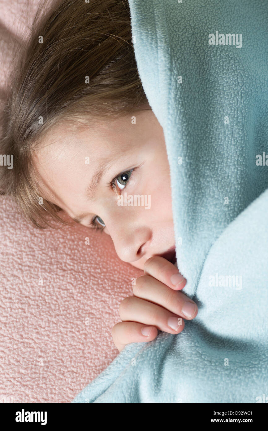 Girl under blanket Stock Photo Alamy