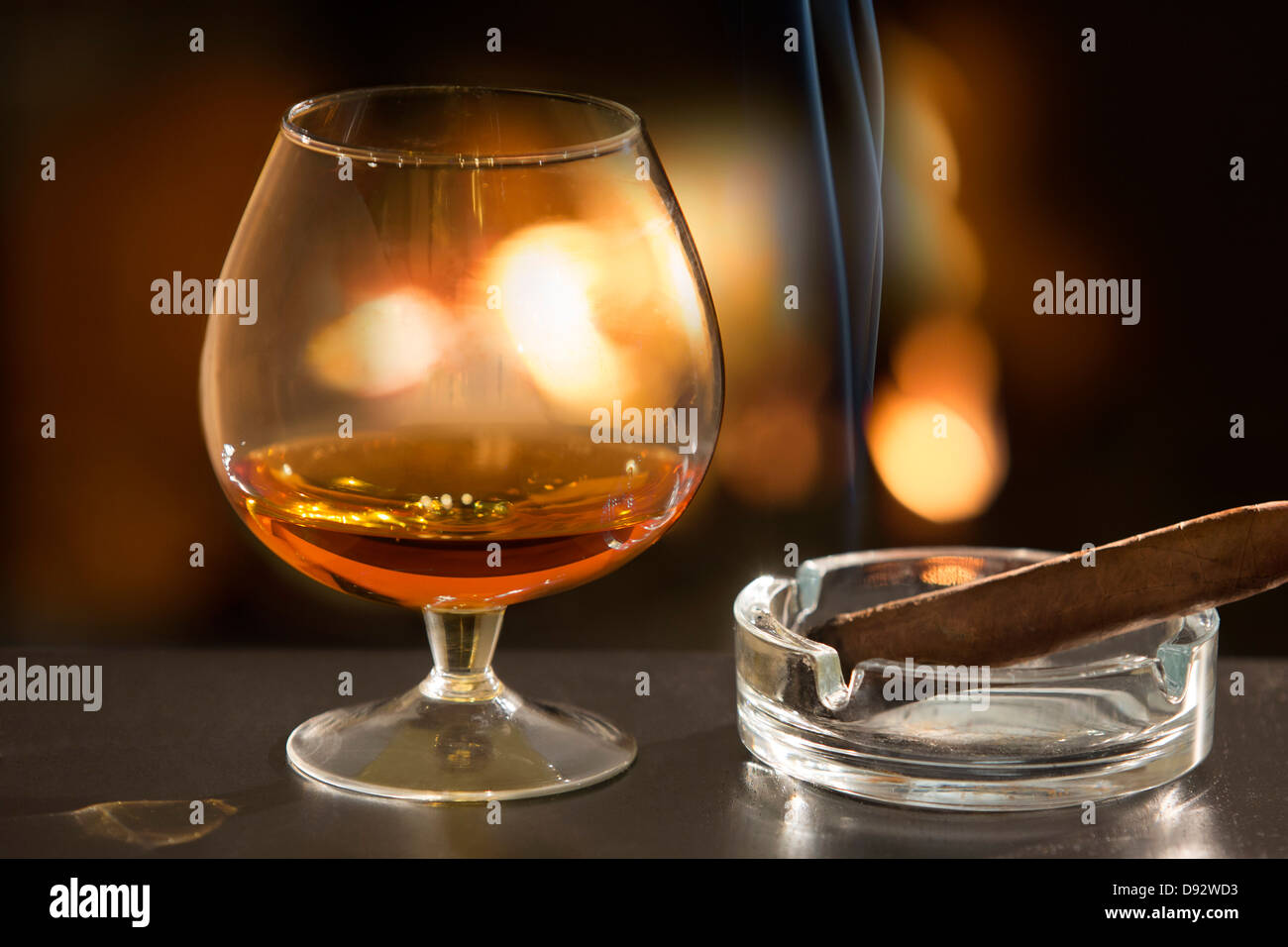Brandy glass and cigar Stock Photo