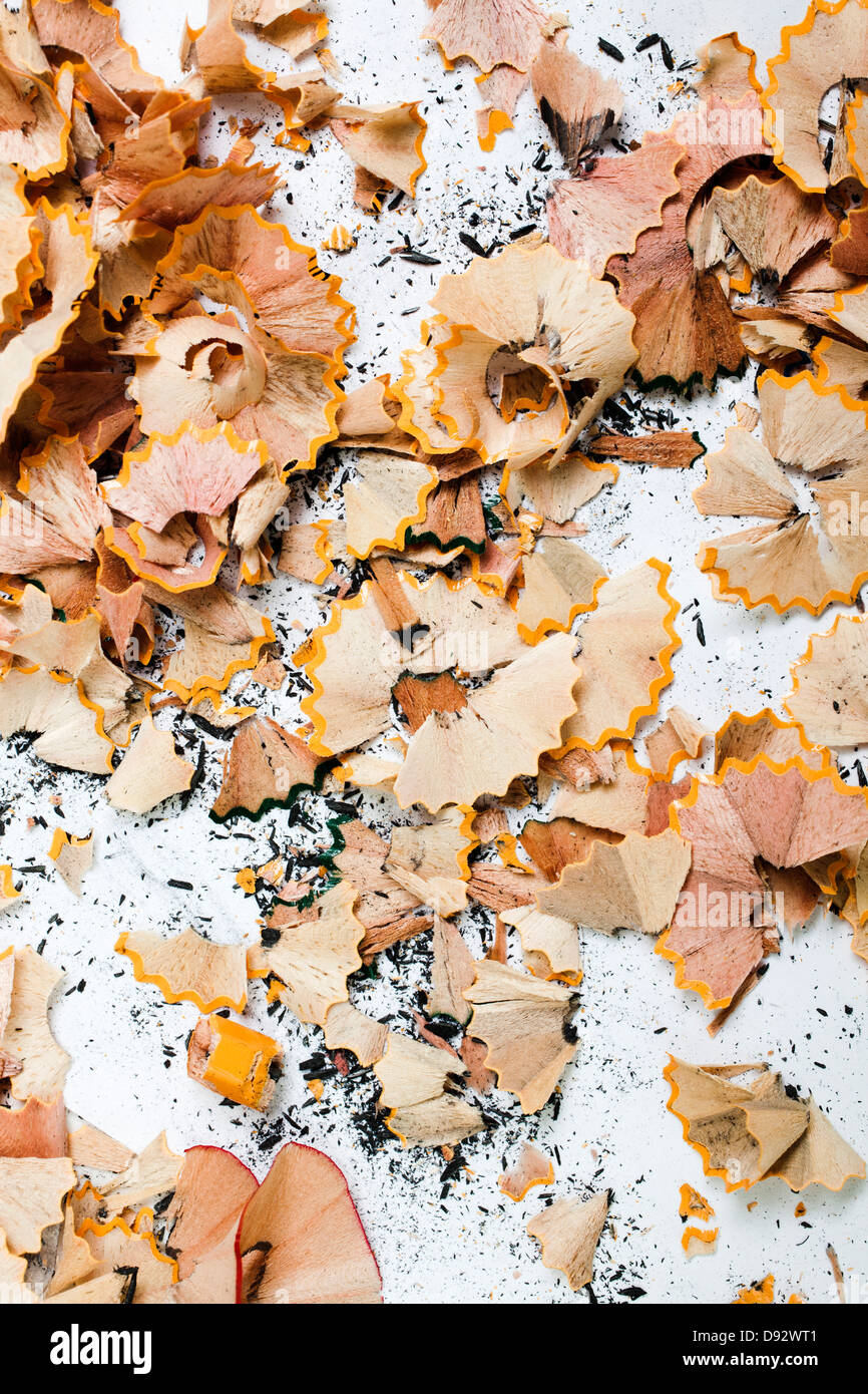 An abundance of pencil shavings and lead on a white background Stock Photo