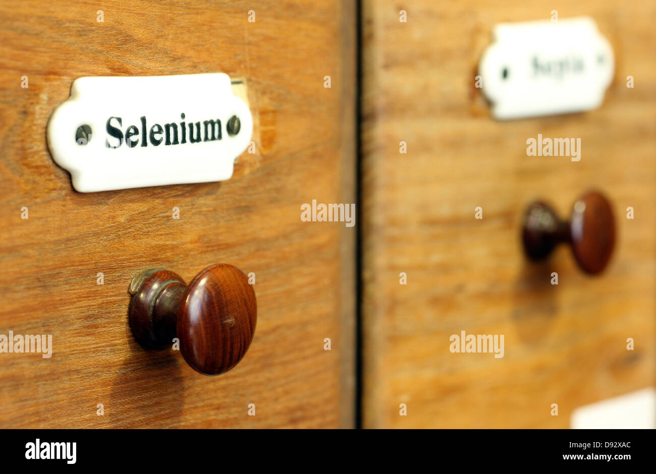 A wooden drawer in pharmacy containing the chemical element Selenium Stock Photo