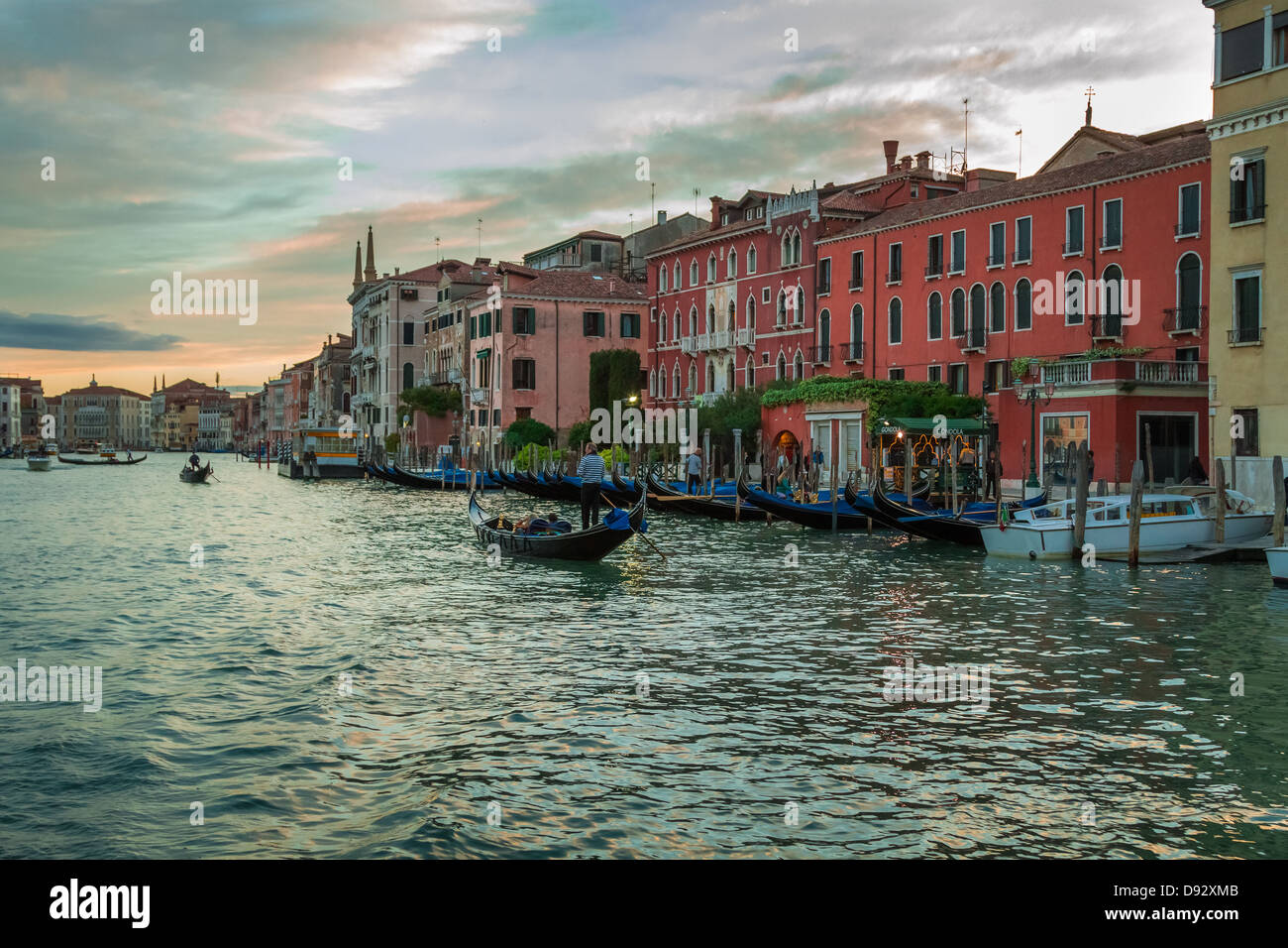 Gondolas floating on the Grand Canal at sunset in Venice Stock Photo ...