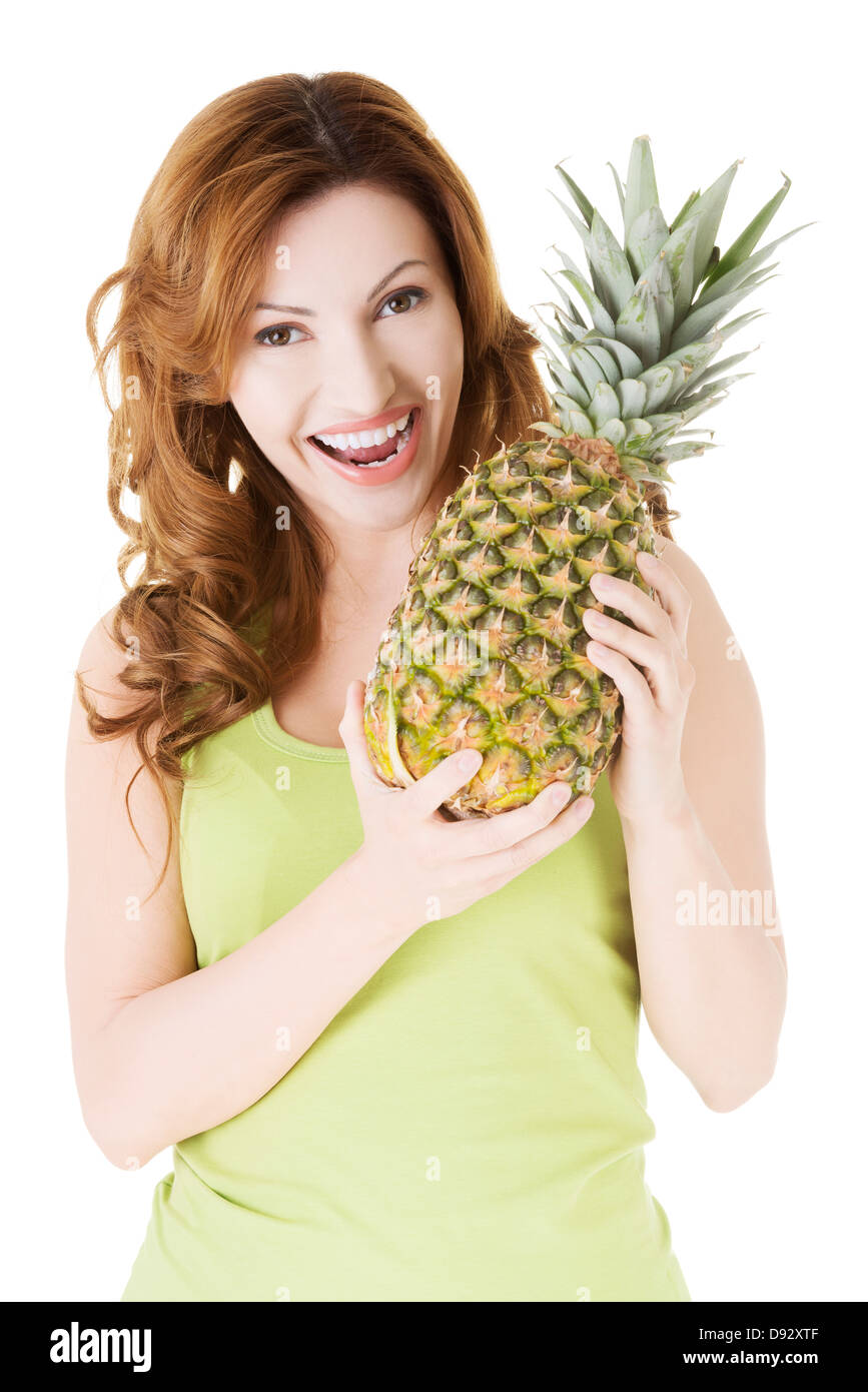 Happy woman with fresh pineapple fruit, isolated on white Stock Photo