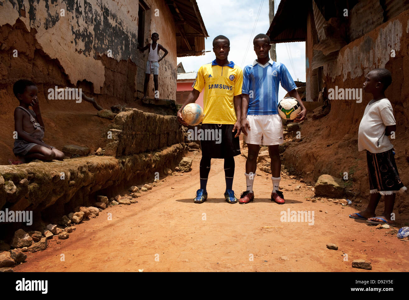 A portrait twins holding football young boys stay Football Academy in