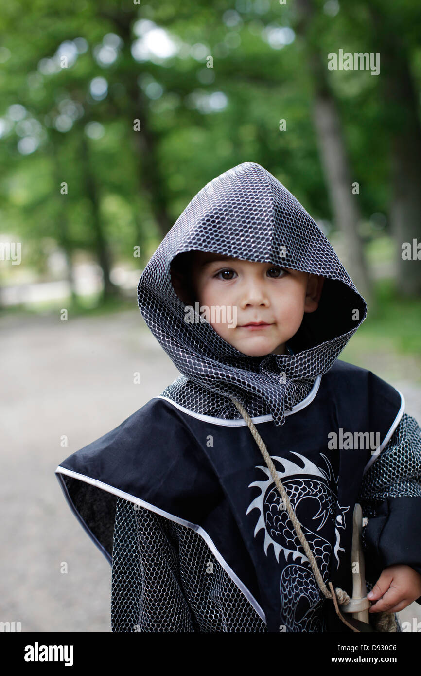 Boy wearing coat of mail Stock Photo