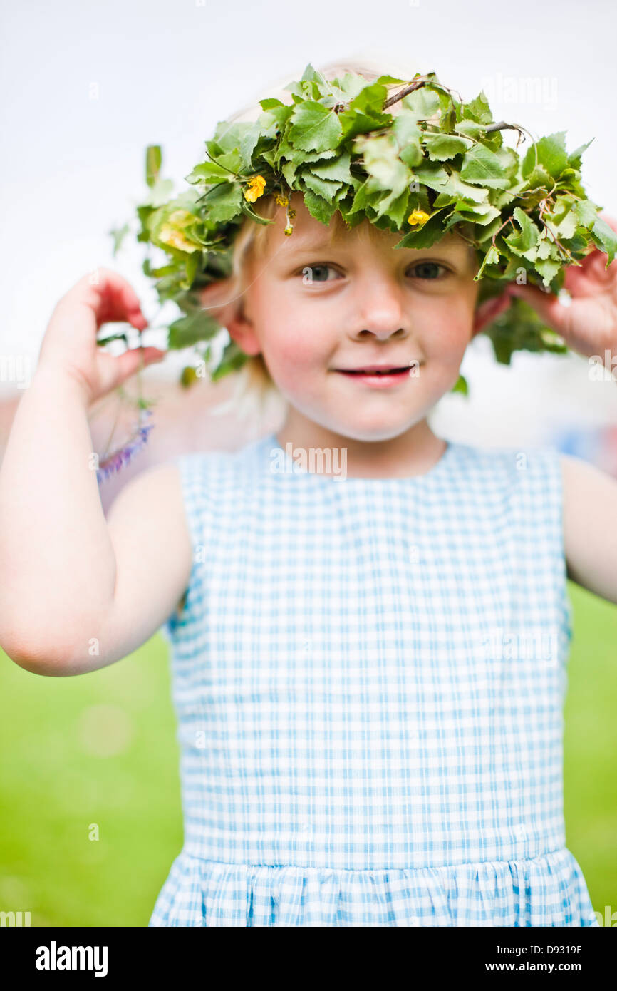 Smiling girl wearing wreath of flowers Stock Photo - Alamy