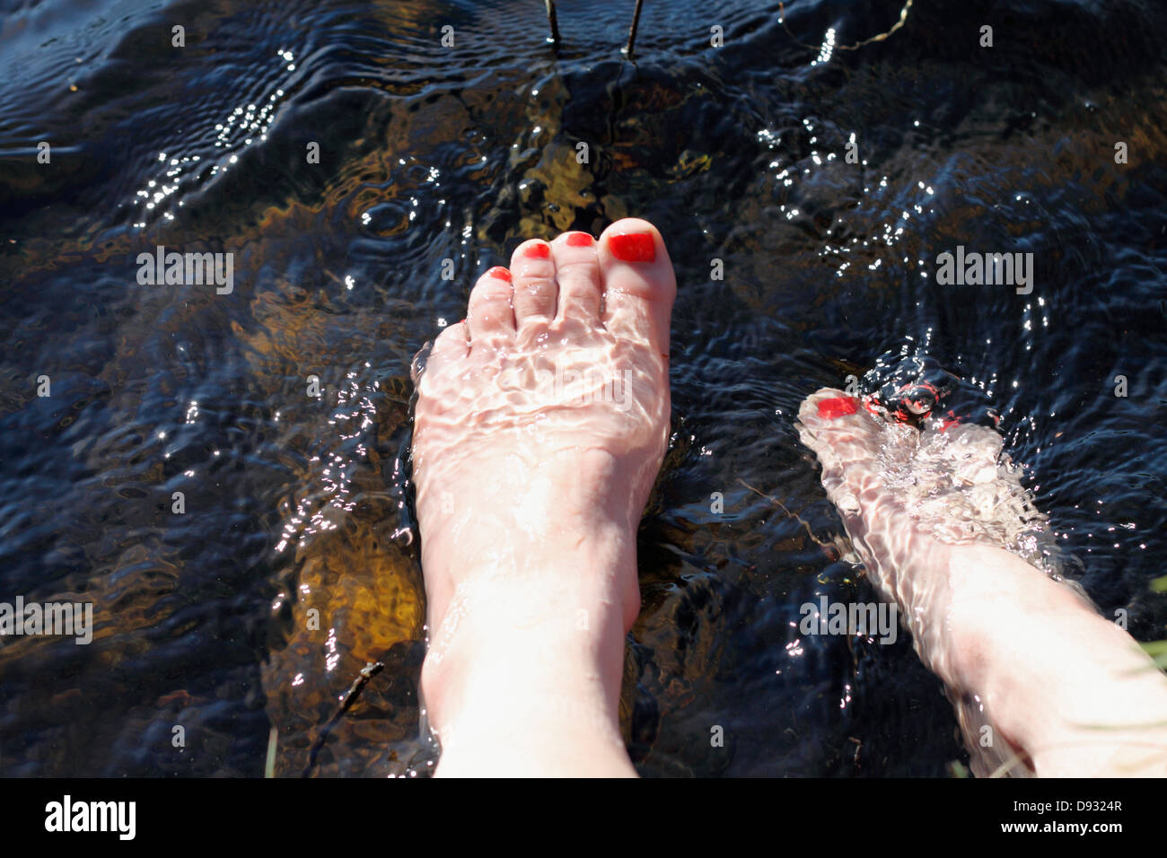 Foot in water Stock Photo